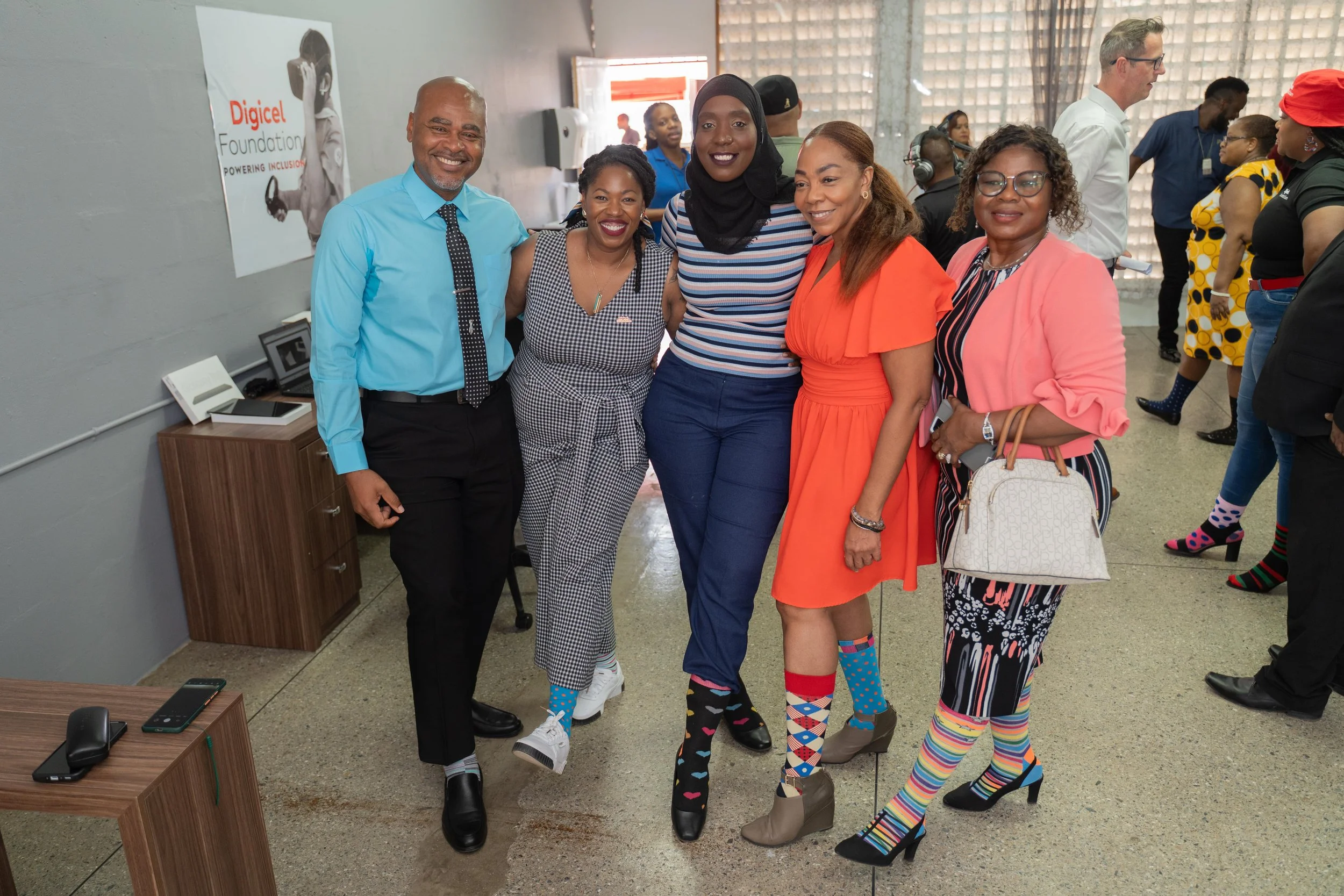 Rocking their socks for World Down Syndrome Day, from left to right: Anderson Le Barrie, School Supervisor I, Victoria West; Cindyann Currency, Head of Operations, Digicel Foundation; Samiya De Bruin, Board Director, Lady Hochoy Centres TT; Penny Gomez, CEO, Digicel Foundation; and Evelyn Ohonba, Principal, Lady Hochoy Gasparillo, at the launch of the Digicel Foundation Innovation Labs on 21 March.