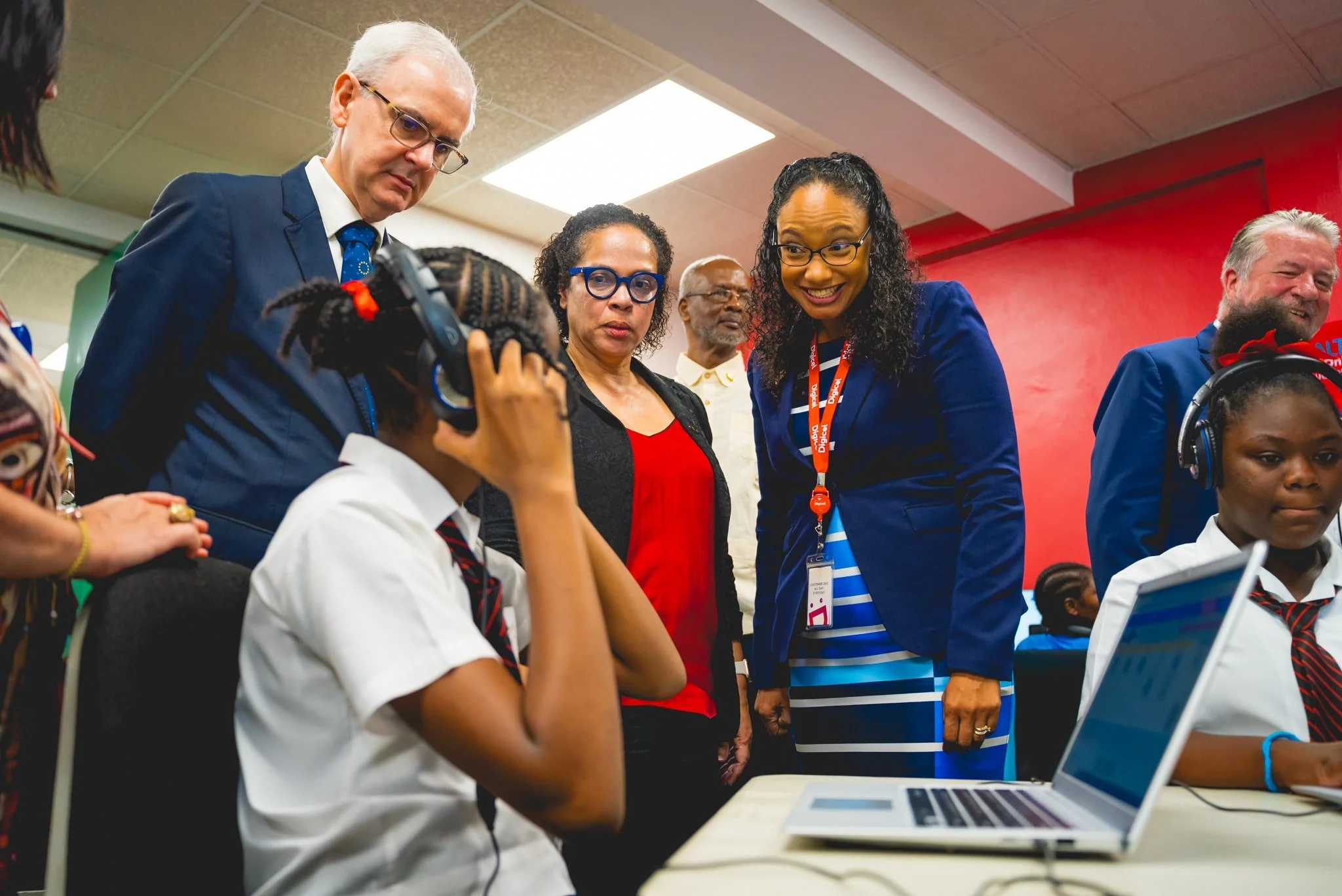 This student eagerly shares her ALTA Online learning progress with Digicel Foundation Director Romona Boiselle-Romano (on the right), in the company of H.E. Peter Cavendish, Ambassador, Delegation of the European Union, and ALTA’s CEO, Arlene Wallace-Romero.