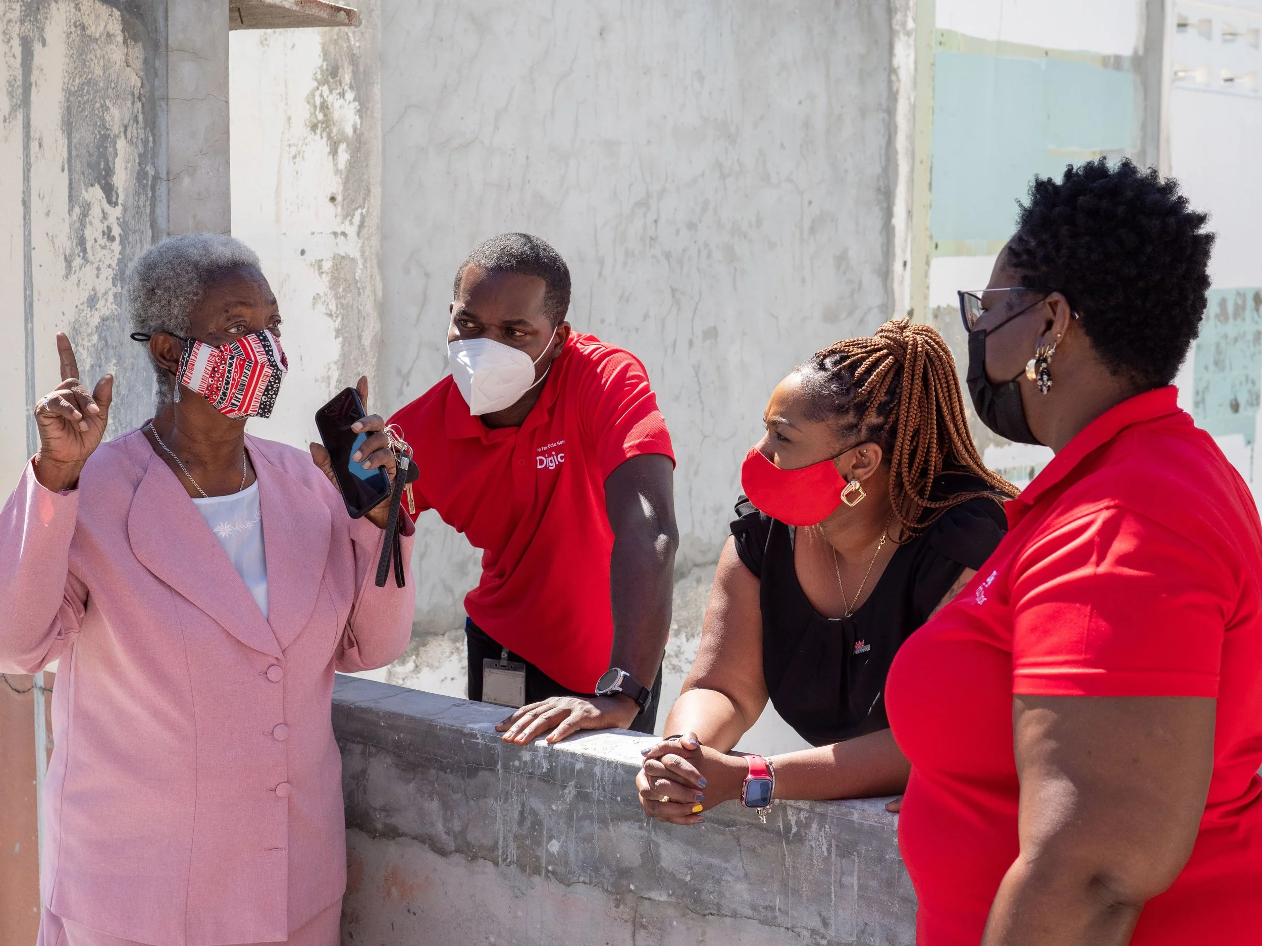 (L-R) Carmen Charles, Secretary of Pembroke Cultural Stars (TTARP) chats with the Digicel Foundation team.
