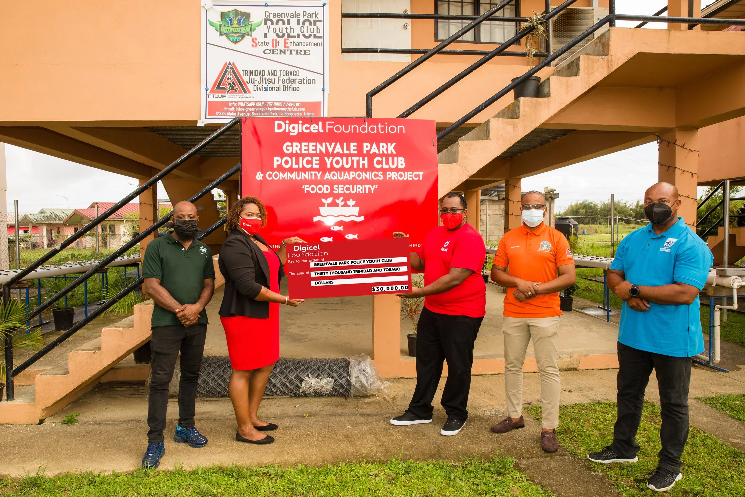 (L-R): Sean Austin - Greenvale Park Police Youth Club Agripreuner Coordinator, Digicel Foundation Board Director, La Toya Gopaul, Digicel Senior VAS and billing Engineer, John Ramirez, Professor Oluyemi Mashama - Greenvale Park Police Youth Club Assistant Leader. Norman Sorzano - Greenvale Park Police Youth Club President stand for a photo op during the brief cheque presentation ceremony.