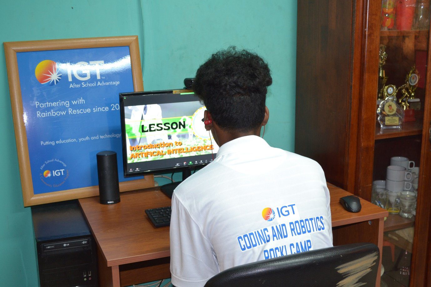 One of the students at Rainbow Rescue is engrossed in the ‘Introduction to Artificial Intelligence’ lesson which is one of the many topics being explored in the IGT Coding and Robotics Rock! Camp.