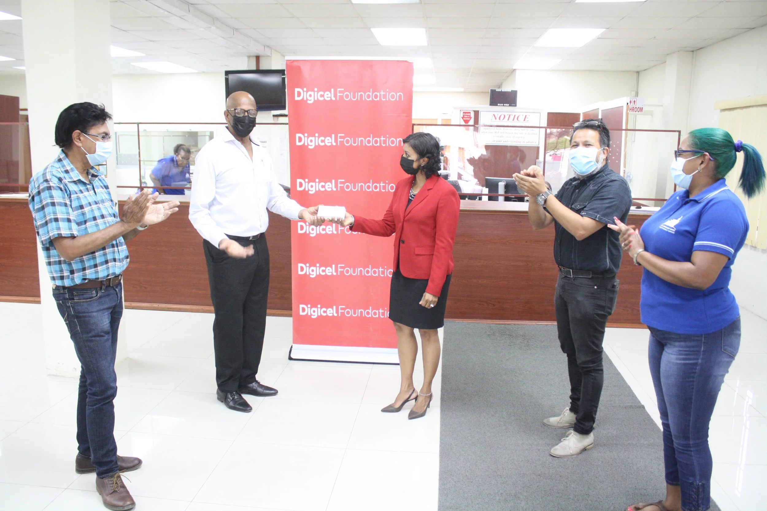 Councillor Ryaad Hosein for Les Efforts East/Cipero, His Worship The Mayor Alderman Junia Regrello, Chairperson of the Digicel Foundation, Mrs Desha Clifford, Councilor Naigum Joseph for Springvale/Paradise and Alisha Ali, Office Manager, The Office of the Member of Parliament for San Fernando West looks on during the presentation of vouchers.