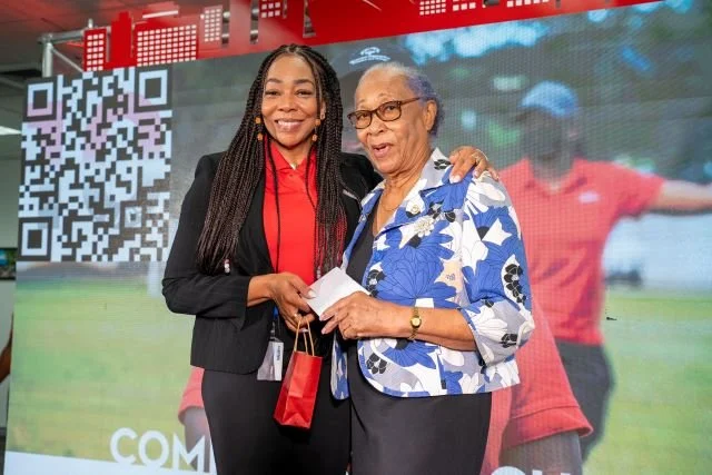 Digicel Foundation CEO Penny Gomez presents an award to Barbara Alleyne, CEO of Goodwill Industries, for her outstanding contributions to special needs during the Digicel Foundation’s AGM on 26 July 2023.