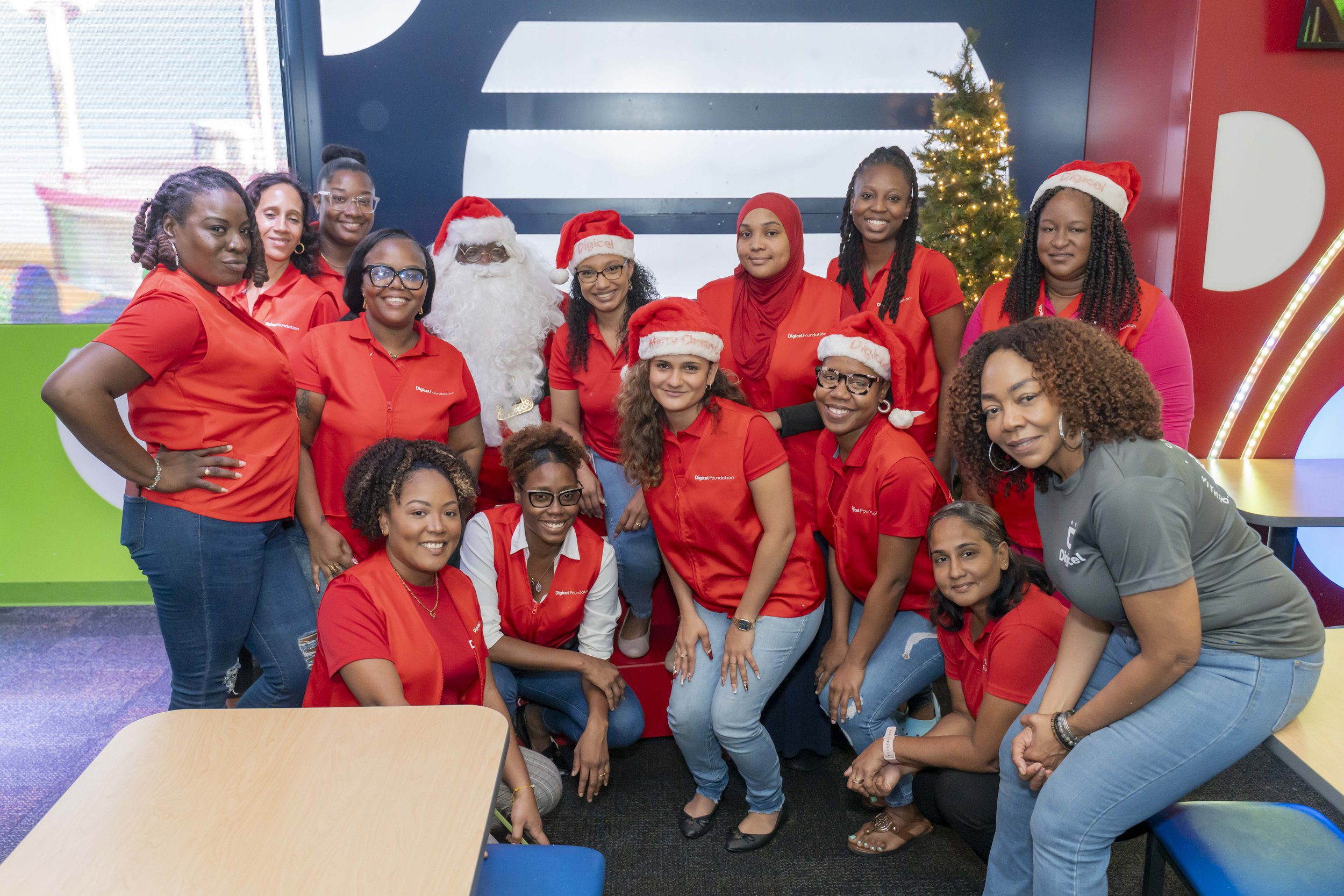 Santa helped these Digicel staff volunteers make the day even more memorable for children attending the Digicel Foundation’s Christmas Party for Special Needs Schools on 28 November.