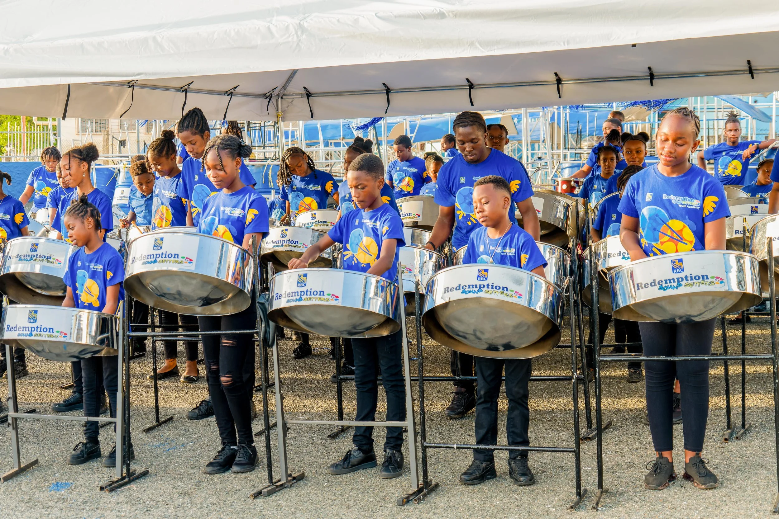Youth members of RBC Redemption Sun Setters in Tobago celebrate the launch of the Panyard's new Technology in Education (TIE) Centre, 27 March.