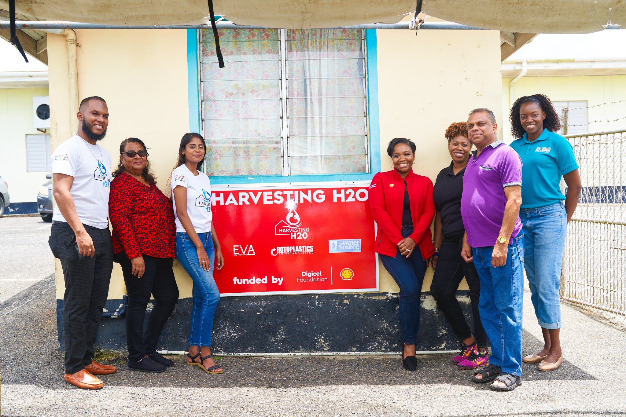 Promoting water security with rainwater harvesting at Clarke Rochard Government School, from left to right: EVA Foundation’s Director Keston James, Director Barbara Pardasie and Founder Evangeline Pardasie with Ryssa Brathwaite, Shell T&T’s Social Performance and Social Investment Advisor, Cindyann Currency, Digicel Foundation Head of Operations, Mr. Ramsubhag, Head of Department at Clarke Rochard Government Primary School, and Shandy Anderson of Water Source Ltd.