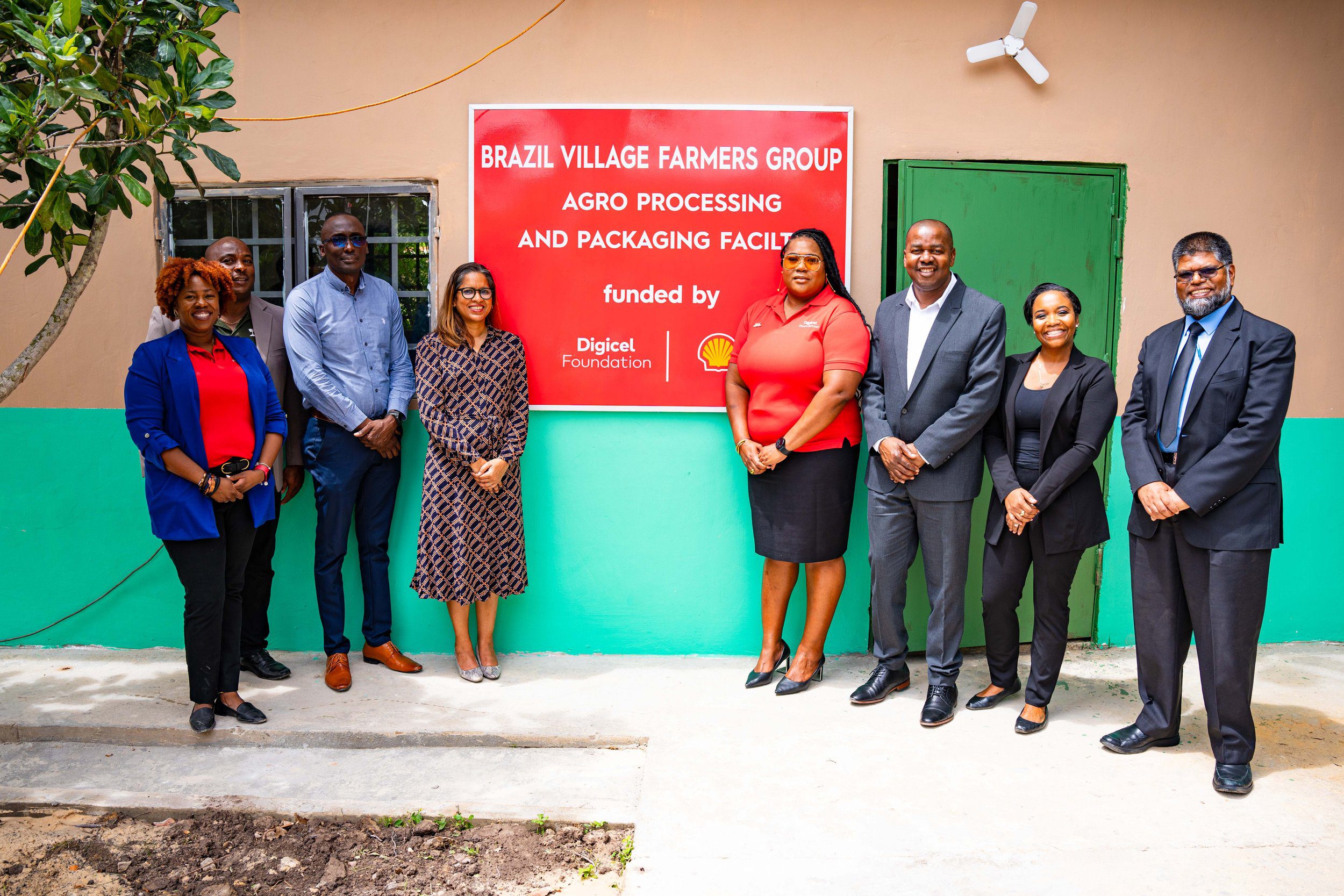 Mr. Farook Hosein, Permanent Secretary in the Ministry of Agriculture, Land and Fisheries (far right), and the Hon. Foster Cummings, MP for La Horquetta/Talparo Constituency (third on the right), join representatives from The Digicel Foundation, Shell Trinidad and Tobago and The Brazil Village Farmers Group to launch the new Agro Processing and Packaging Facility at Brazil Lome Trace on Wednesday 21 February 2024.