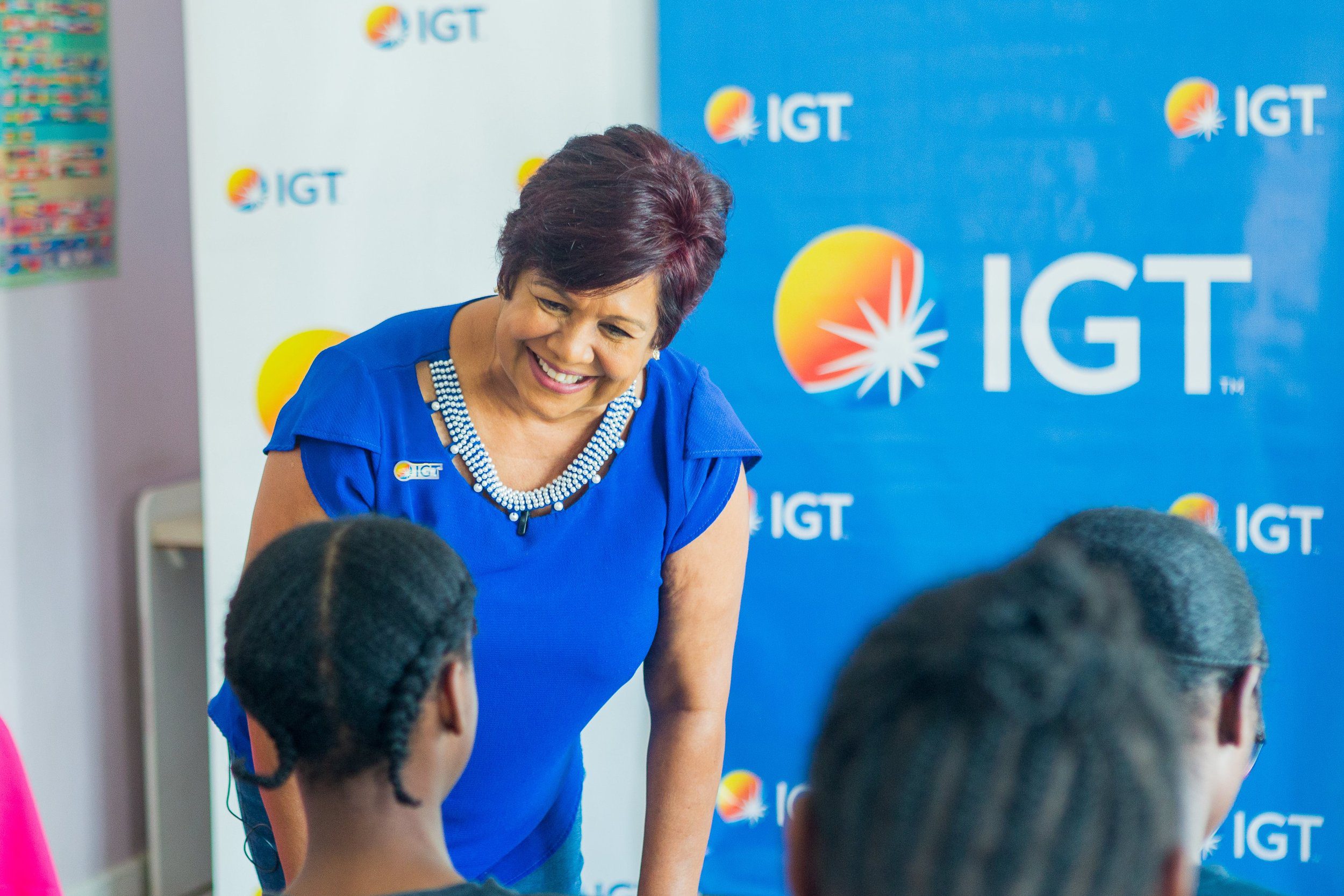 Shavindra Tewarie-Singh, IGT’s People & Transformation Regional Senior Manager for the Caribbean, listens as the girls from Credo Sophia House open up about their future goals during a career guidance session on Saturday, 2 March 2024.