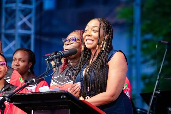 Digicel Foundation CEO Penny Gomez (at the podium) and Pan Trinbago President Beverley Ramsey-Moore announced their partnership to commission 8 tech centres at pan yards on 11 August 2023, World Steelpan Day.