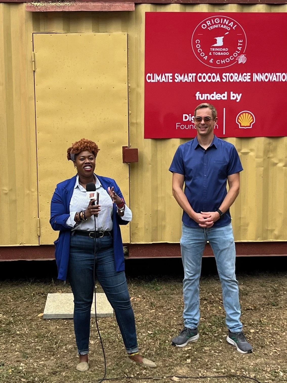 (L-R) Digicel Foundation Head of Operations Cindyann Currency gives her remarks alongside Tobias Frenking of the Original Trinitario Cocoa Education Foundation (OTC) during the unveiling of the new Climate Smart Cocoa Storage facility.
