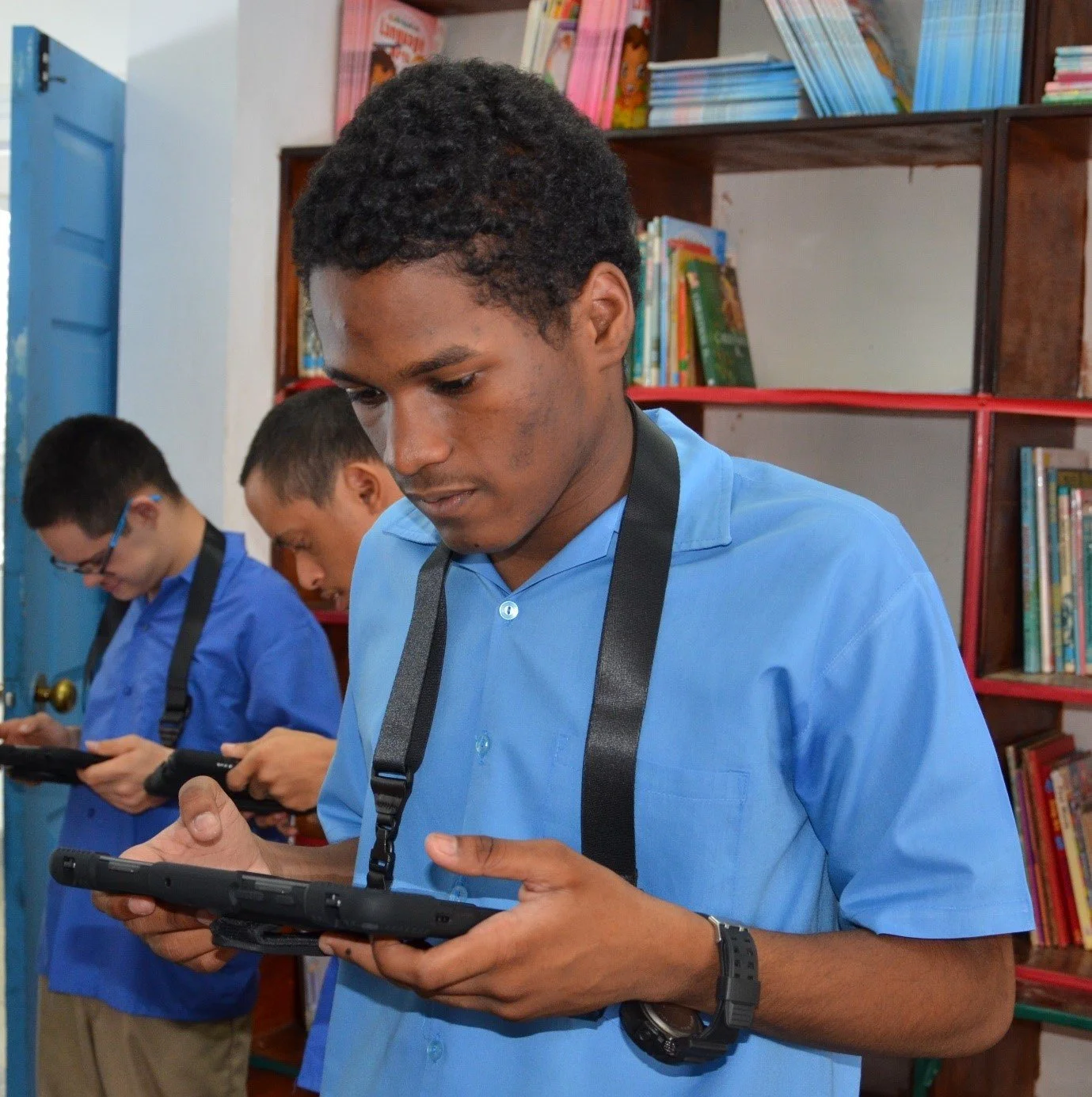 All engrossed in learning! These students use the tablets donated to the Immortelle Centre through the IGT After School Advantage programme.