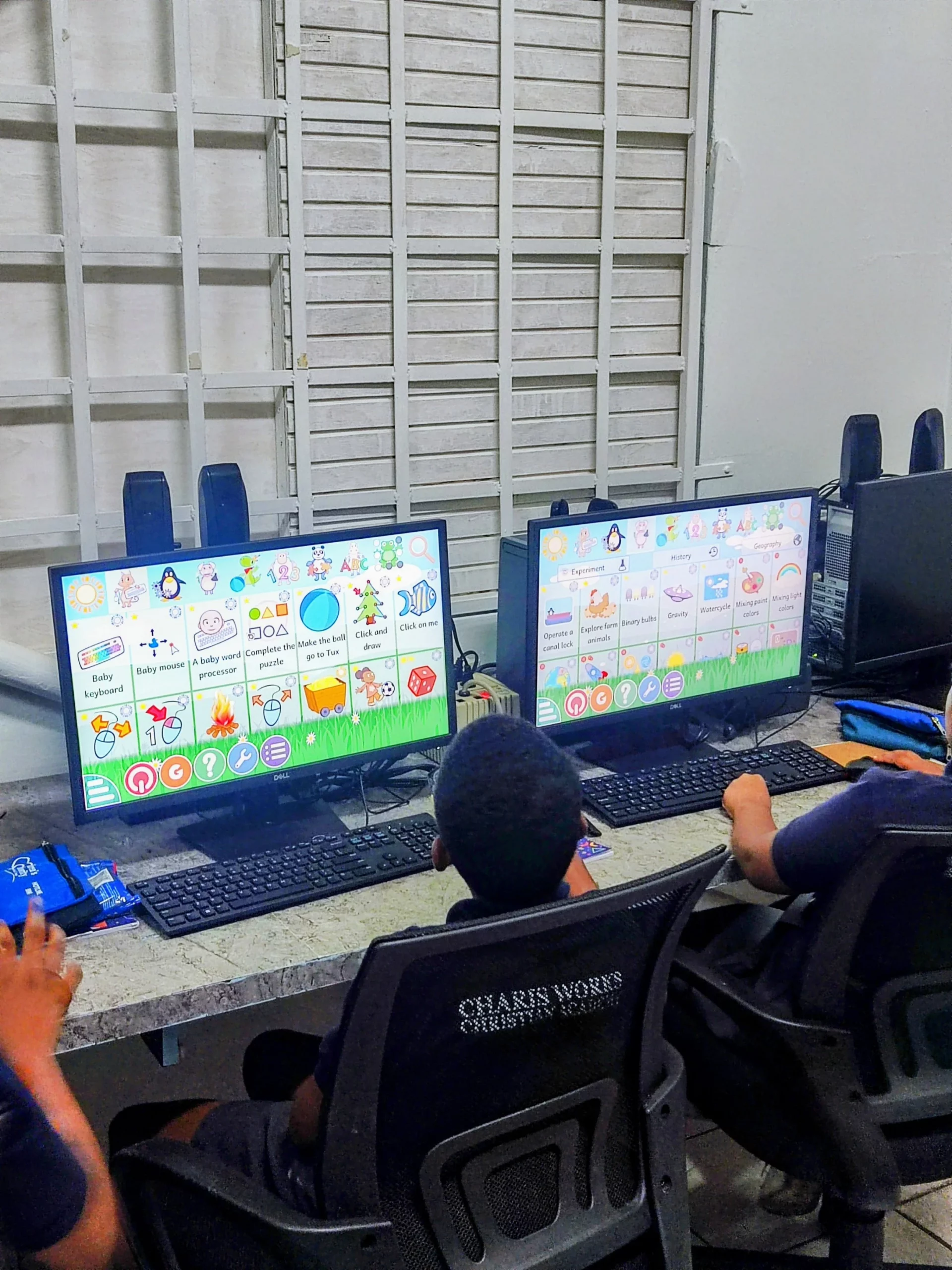 Pushing through another lesson at their own pace, these boys make the most of the Digicel Foundation Innovation Lab at their school.