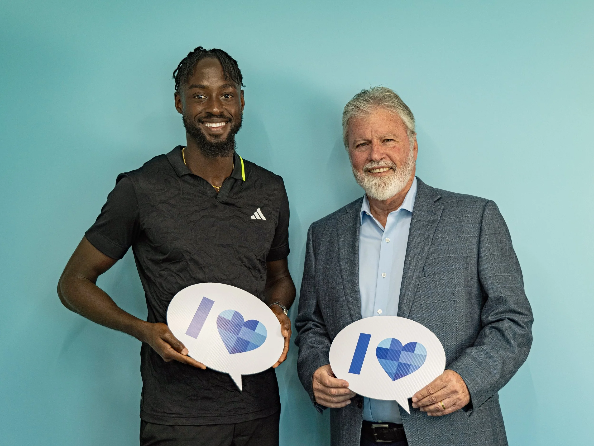 (L-R) T&T’s Track and Field Olympian Jereem Richards with Michael Conyers, Deputy Chairman of The Brydens Group.