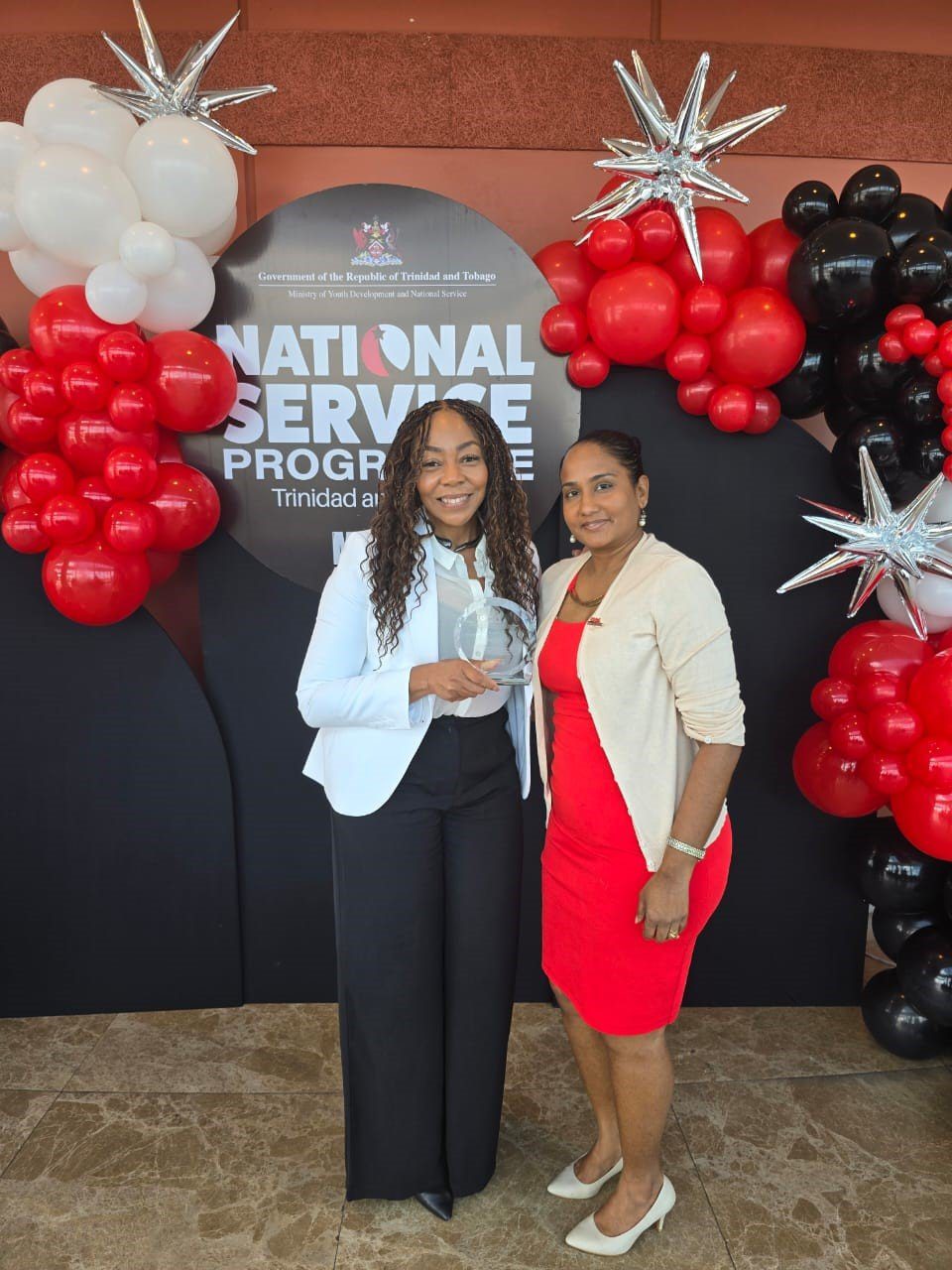 (L-R) Penny Gomez, Digicel Foundation CEO, with Diana Mathura Hobson, Digicel Foundation Project Officer, at the inaugural award ceremony for the Ministry of Youth Development and National Service (MYDNS) National Service Programme (NSP-TT) on 30 July.