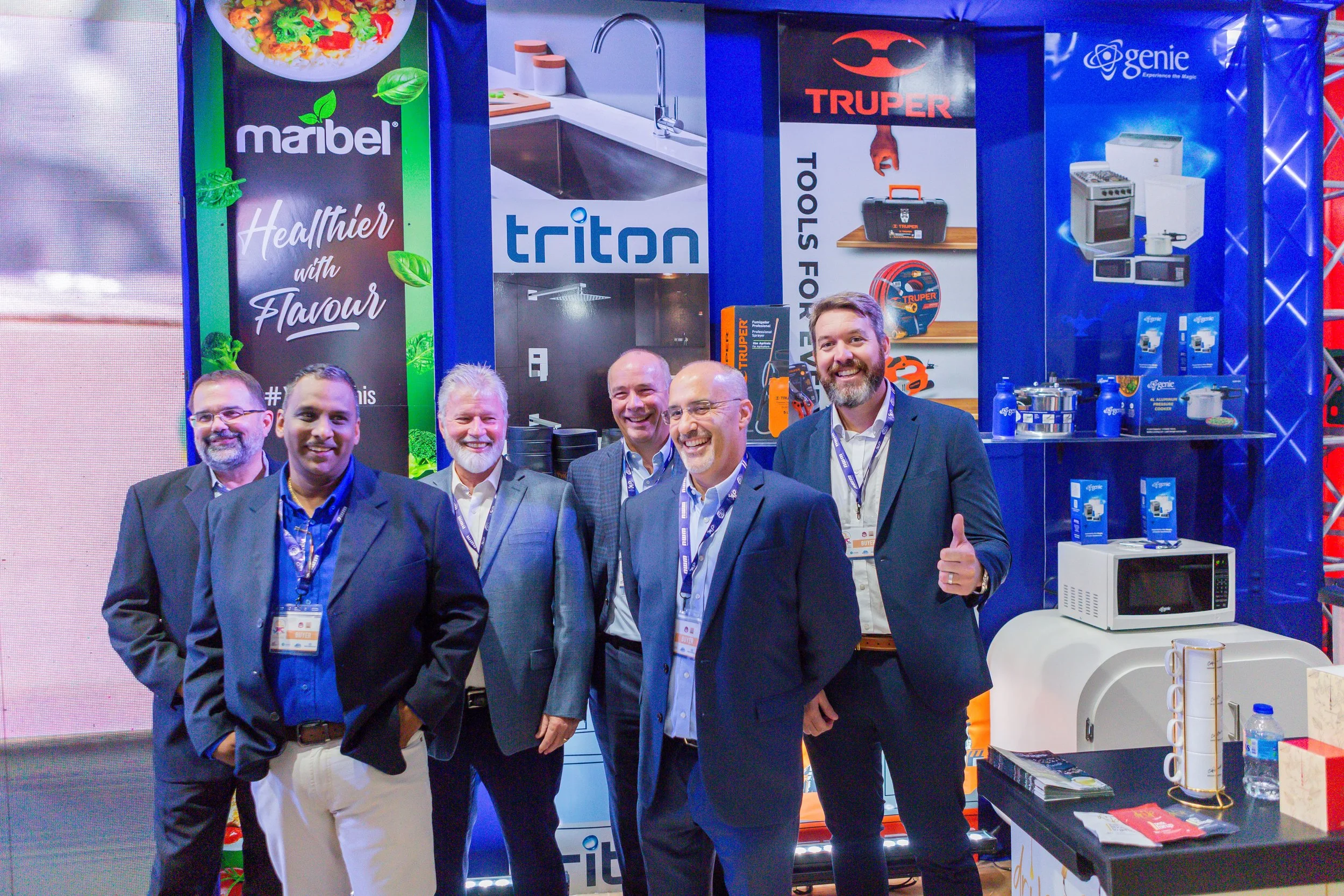 From left to right Managing Director of Franco Trading & Distribution Limited & Head of Shared Services & Special Projects, The Brydens Group, Scott Franco; Managing Director, Bryden pi, Barry Tangwell; The Brydens Group Deputy Chairman, Michael Conyers; Managing Director, A.S. Bryden & Sons (Trinidad) Limited, Stephen Welch; Managing Director, Micon Marketing Limited, Gerard Conyers; and Managing Director/CEO, F.T. Farfan, Andrew Crooks at TIC 2023.