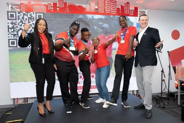 Digicel Foundation CEO Penny Gomez (far left) and Digicel TT CEO Abraham Smith (far right) celebrate the year’s successes with athletes from the Special Olympics Trinidad and Tobago (from left to right) Malachi Sylvester, Cadell Cuffy, Victoria Samuel and Omari Patterson at the Digicel Foundation’s AGM on 26 July 2023.