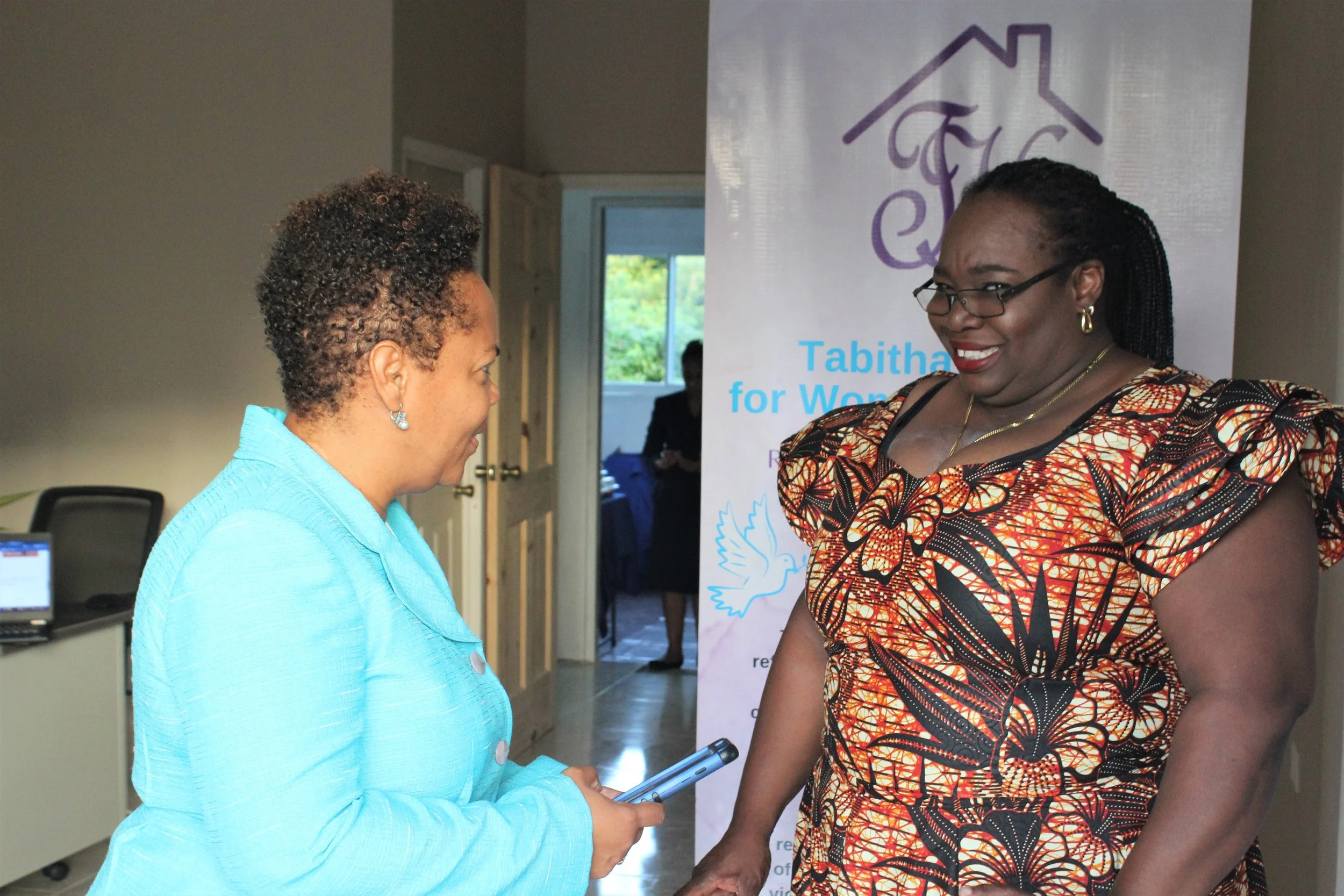 (L-R) President of Tabitha’s Home for Women and Children Rowena Pitt and Treasurer Donna Grant Moore share a light moment at the Home’s launch event on 15 December.