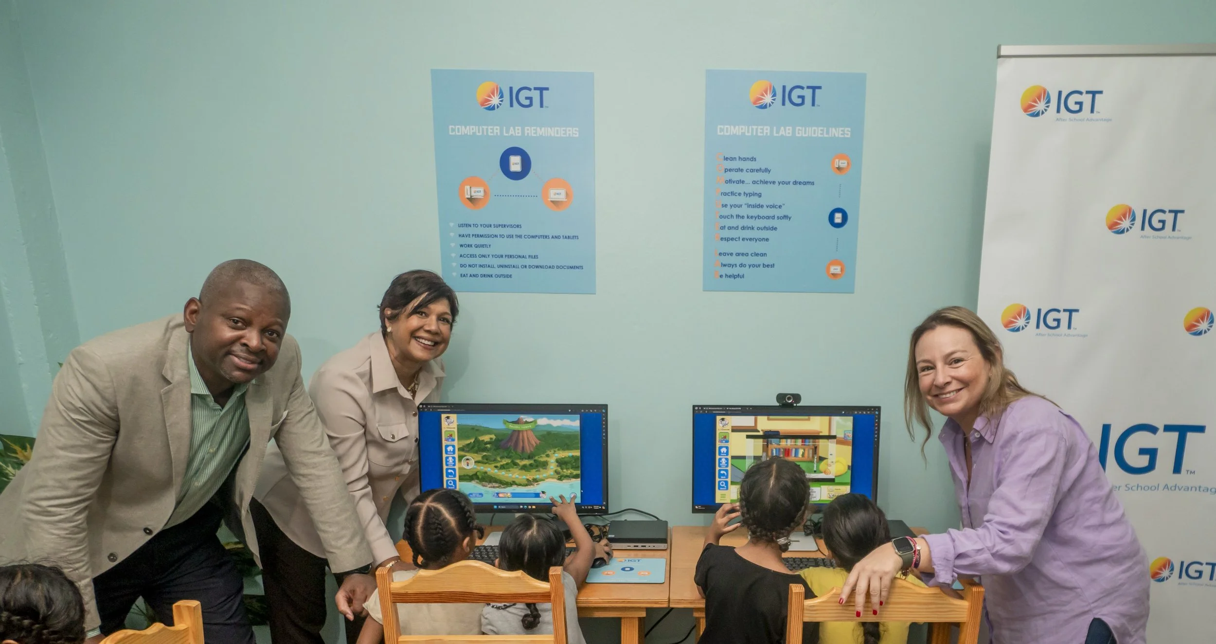 (L-R) Dexter Thomas, IGT General Manager - Trinidad and Tobago, Shavindra Tewarie-Singh, IGT People & Transformation Regional Senior Manager for the Caribbean, and Diana Acosta, IGT Director People and Transformation LAC, pose briefly while assisting young learners at Amica House in 2024.