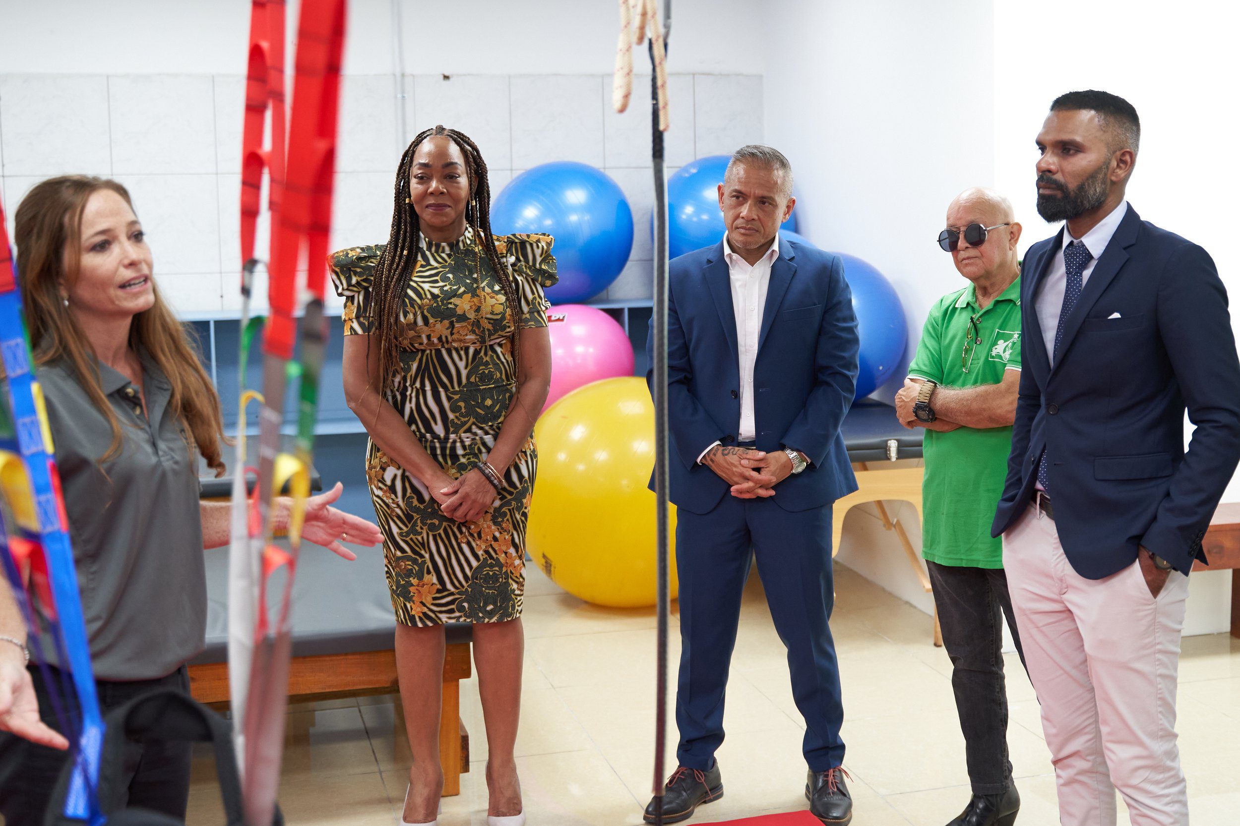 (L-R) Krista Hamel-Smith, General Manager of CKFTO, explains the sensory occupational therapy tools in the gym at the Chaguanas Clinic, in the company of Penny Gomez, CEO, Digicel Foundation; Derek Luk Pat, Chairman, CKFTO; Philip Metivier, President, Cerebral Palsy Society, and the Mayor of Chaguanas, Faaiq Mohammed.