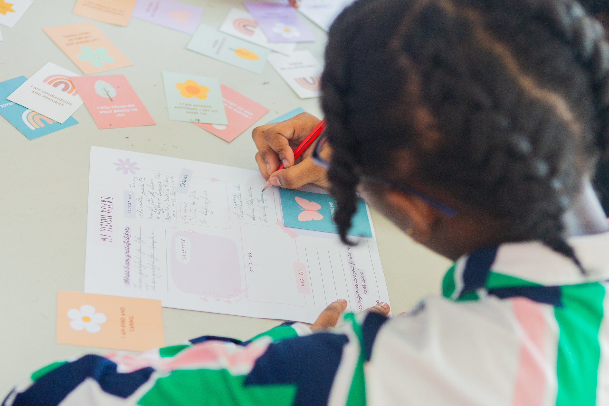 This young lady works on her vision board during IGT’s career guidance session at Credo Sophia House on Saturday, 2 March 2024.