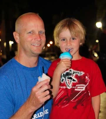 Freezee for all! Dad and son enjoying Freezee’s cool flavours: White Cherry and Freezy Blue.