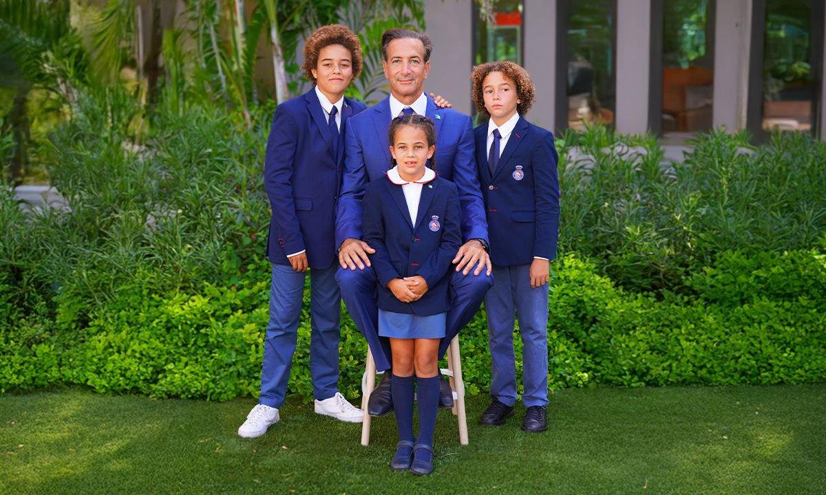 Inspired Education’s Founder, Chairman and CEO Nadim Nsouli (centre) with his children, who attend King’s College School, The Bahamas.