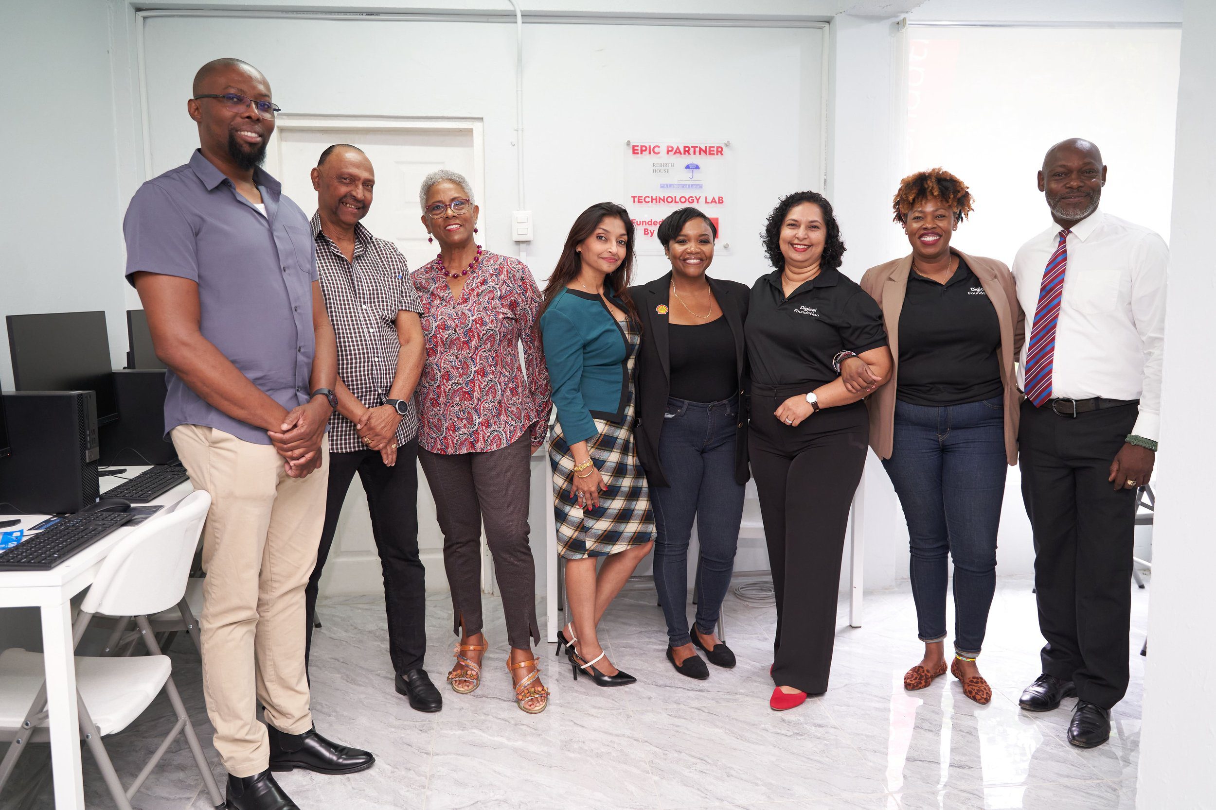 (L-R) Posing together for a group shot are Shannon Edward, Substance Abuse Counselor; Jefferson Jurawan, Clinical Psychologist; Wendy-Ann Wattie, Rebirth House Board Chair; Neela Birjah, Rebirth House CEO; Ryssa Brathwaite, Social Performance and Social Investment Advisor at Shell Trinidad and Tobago; Trijata Maraj, Digicel Foundation Director; Cindyann Currency, Digicel Foundation Head of Operations, and Aidan Thomas, Rebirth House Manager.
