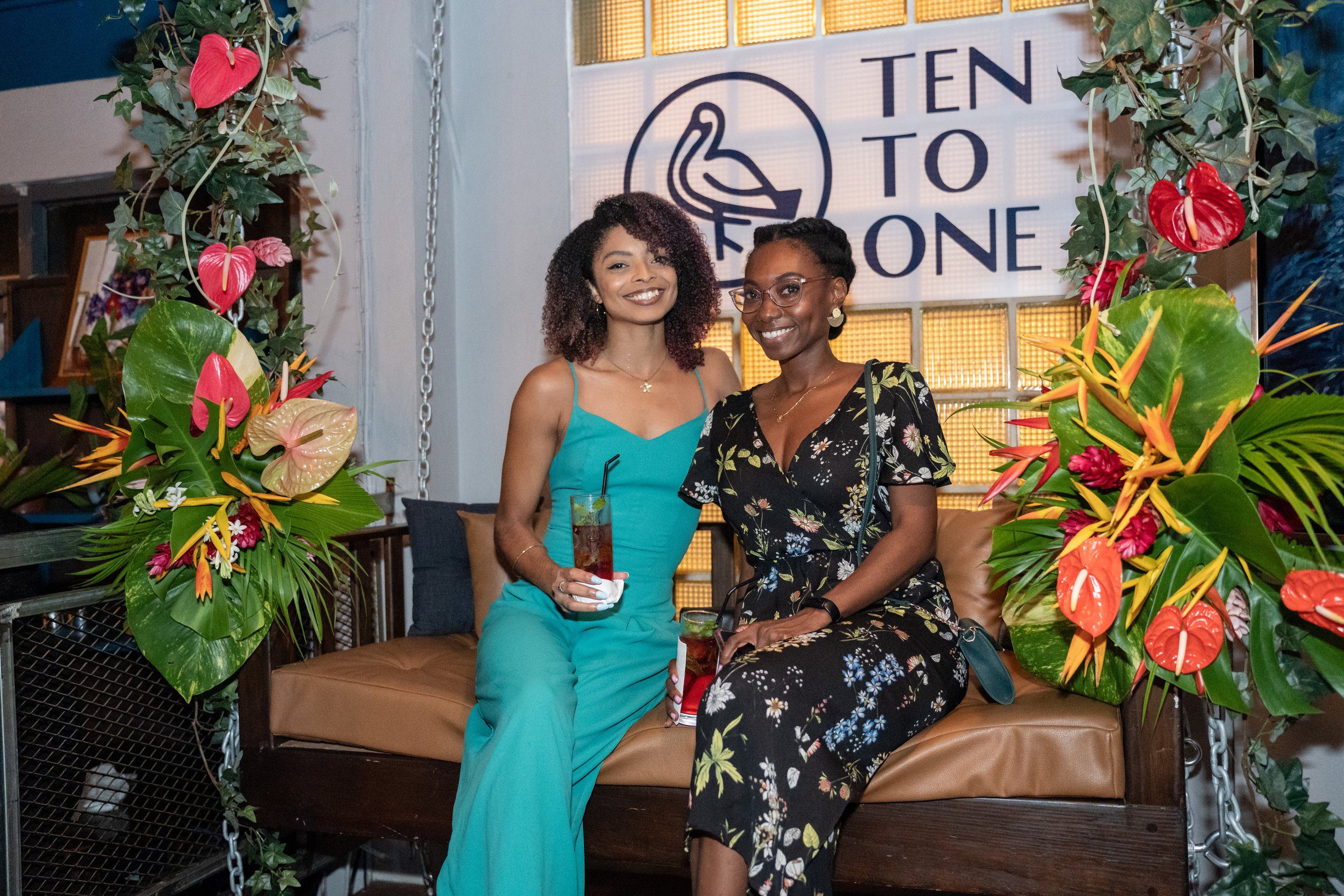 Patrons enjoy Ten to One rum cocktails at a recent event at District Cafe, Woodbrook.