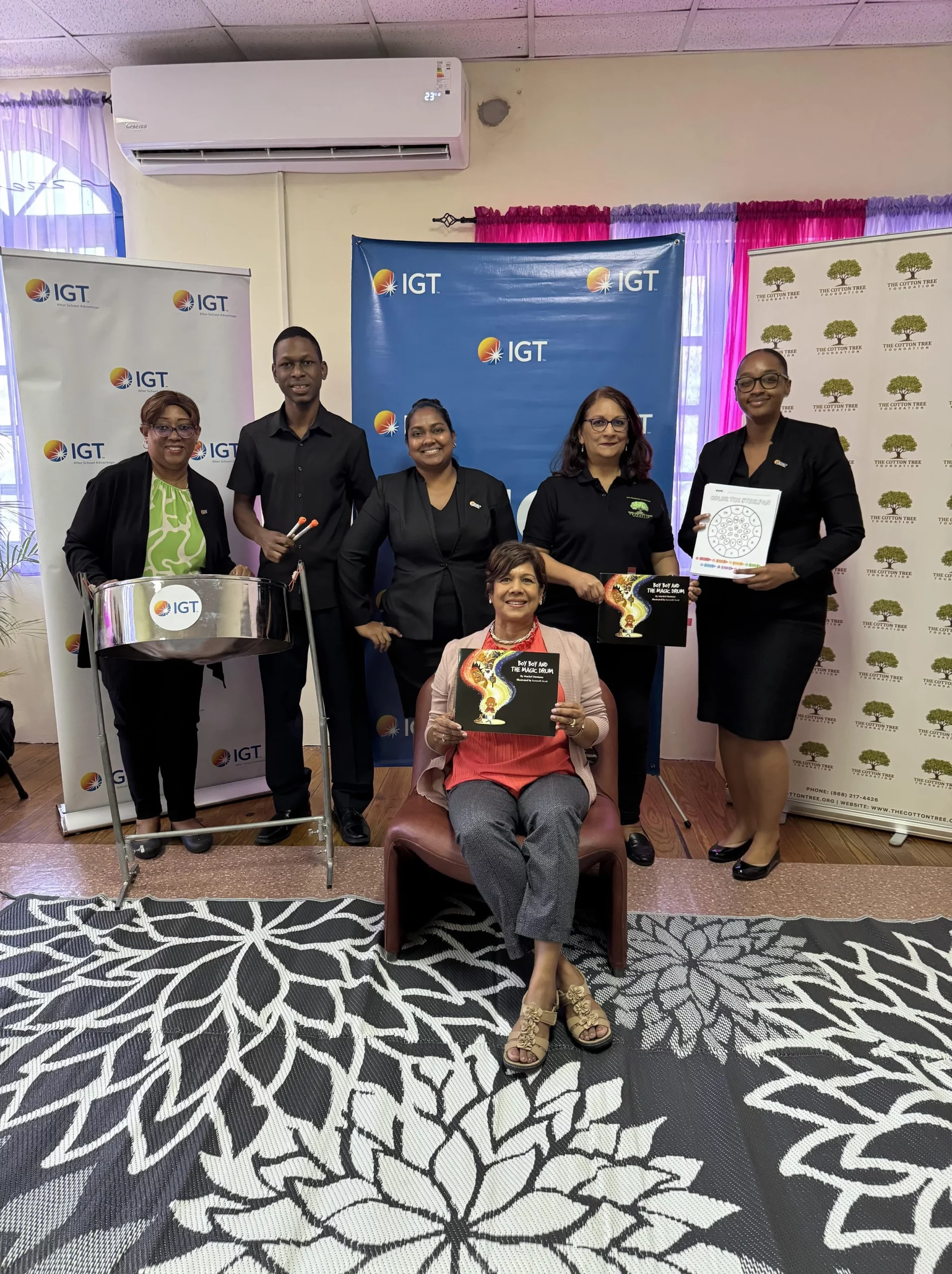 The team organising the steelpan, stories and colouring time for Cotton Tree Foundation’s Preschool Carnival. Back row, left to right: Leslie Ann Baxam – IGT Draw Lead, Chavez Benjamin – Cotton Tree Foundation Steelpan Tutor, Tanya Singh – IGT Global People Services Representative, Sita Persad – Cotton Tree Foundation Executive Director, Chelsea Alleyne – IGT Administrative Assistant, and, in the front, Shavindra Tewarie-Singh – IGT P&T Regional Senior Manager, Caribbean.