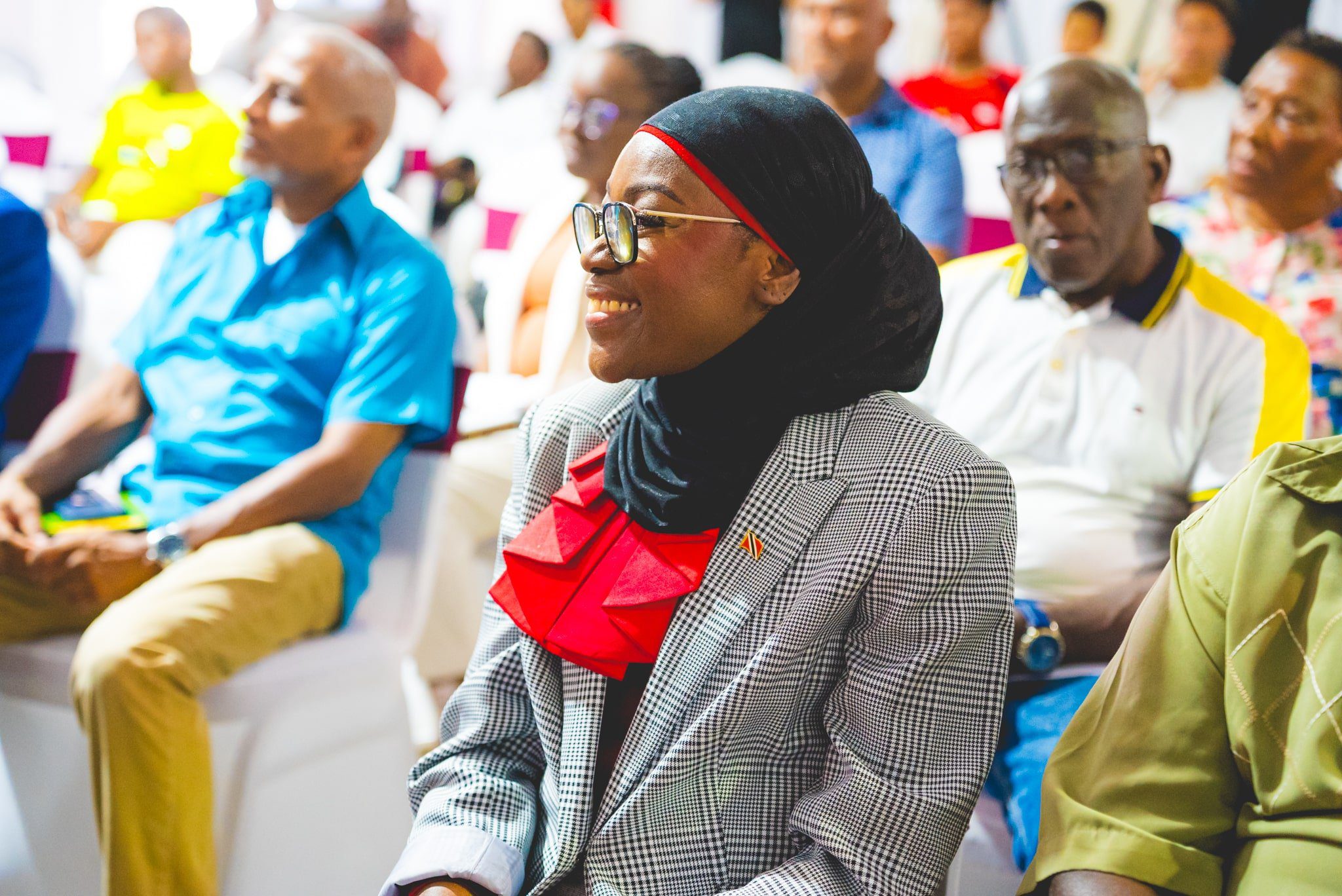 Shihan Marva John Logan, Co-Founder of the Ryu Dan Empowerment Foundation, wears a proud smile as she listens to the beneficiary testimonies delivered during the Ryu Dan Empowerment ‘Operation Kickup’ Project Launch on May 8th.