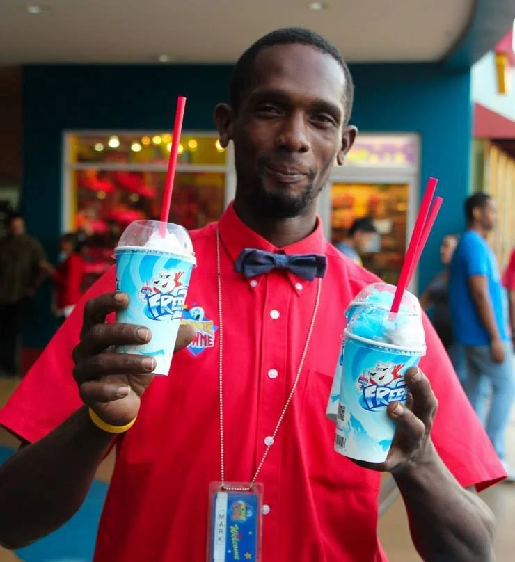 This MovieTowne staff member enjoys the best cool down drink to have on a break