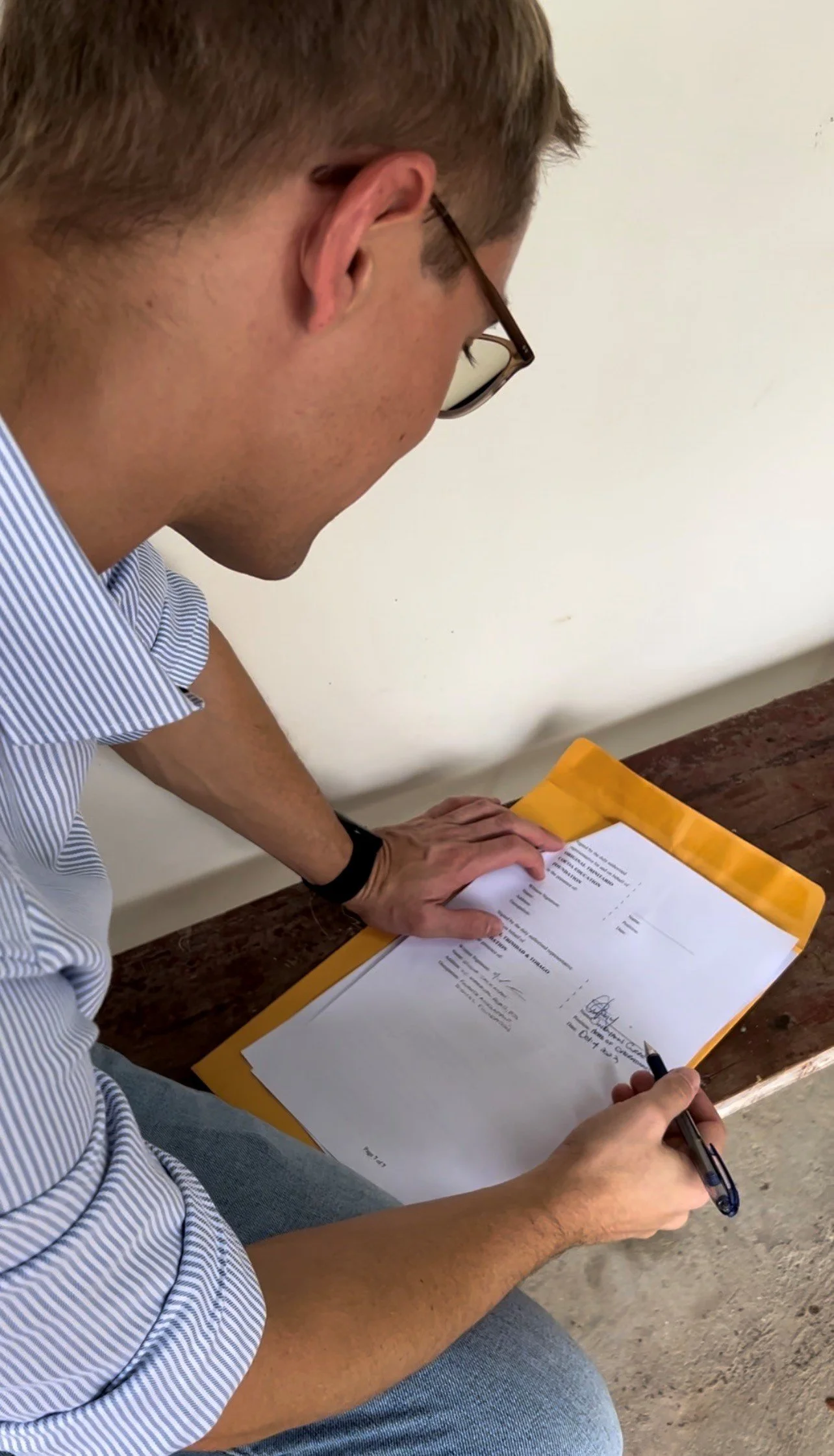 Tobias Schulze Frenking, Manager of the Original Trinitario Cocoa Education Foundation, signs the EPIC programme contract to initiate the group’s Climate-Smart Crop Storage project.