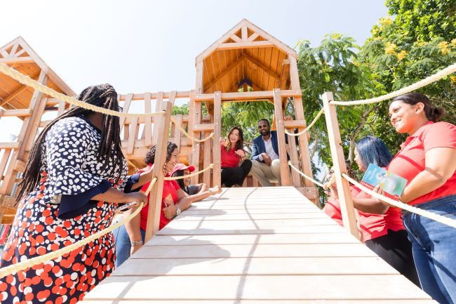 Mayor of Port of Spain Chinua Alleyne (centre right) and Digicel Chairperson Sacha Thompson (centre left) test out the new playhouse at the Nelson Mandela Park Play and Fitness Zone in St. Clair before the Digicel Foundation's International Literacy Day storytelling event on Friday 8 September 2023.