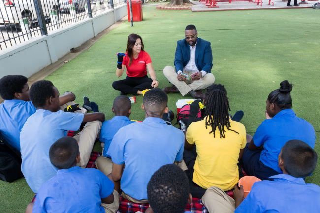 Mayor of Port of Spain Chinua Alleyne is accompanied by Digicel Chairperson Sacha Thompson as he reads aloud to children from Servol Special School, Sunshine Hill, in the Nelson Mandela Park Play and Fitness Zone on International Literacy Day, 8 September 2023.